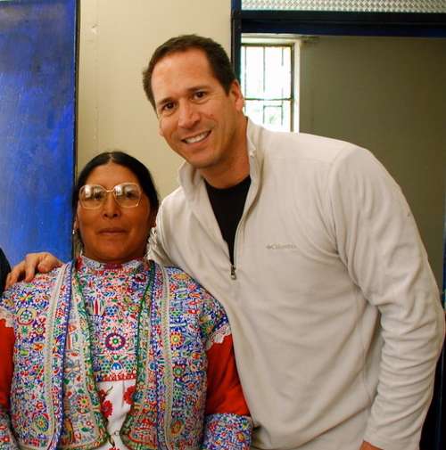 Dr. Tom Barreto with one of the many happy recipients of a new pair of glasses.